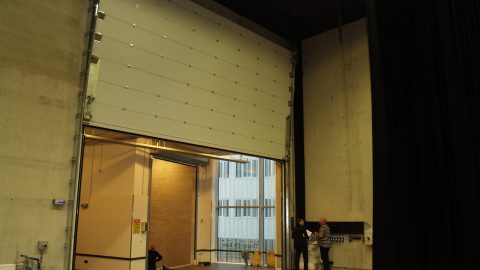 Large sound insulating vertical sliding door - Rw and STC; Backstage theater door
